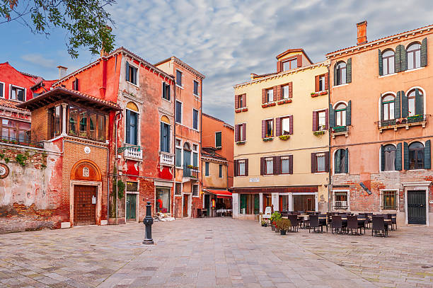 Venice, the capital of the Veneto region in northern Italy, occupies more than 100 small islands in a lagoon of the Adriatic Sea. The city has no roads, only canals, including the Grand Canal, lined with Gothic and Renaissance palaces. At its center, St. Mark's Square is home to St. Mark's Basilica, covered in Byzantine mosaics, and St. Mark's Campanile, which overlooks the red rooftops of Venice.