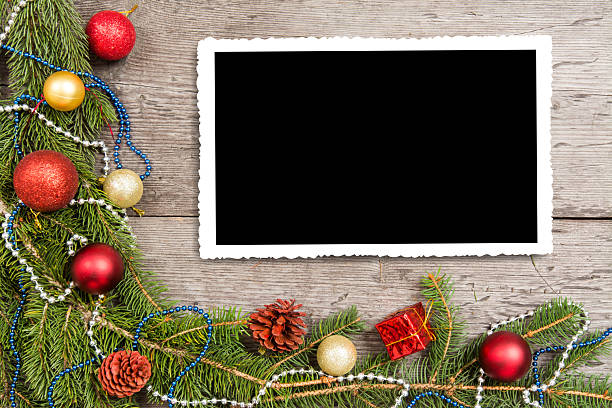 istock Christmas background with decorations and gift boxes on wooden board, empty space for text 2245442776