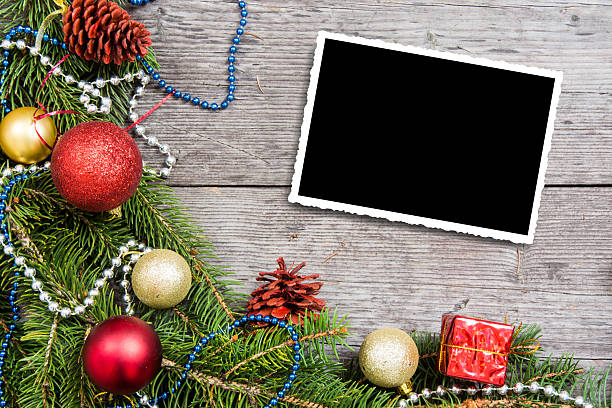 istock Christmas background with decorations and gift boxes on wooden board, empty space for text 2245442800