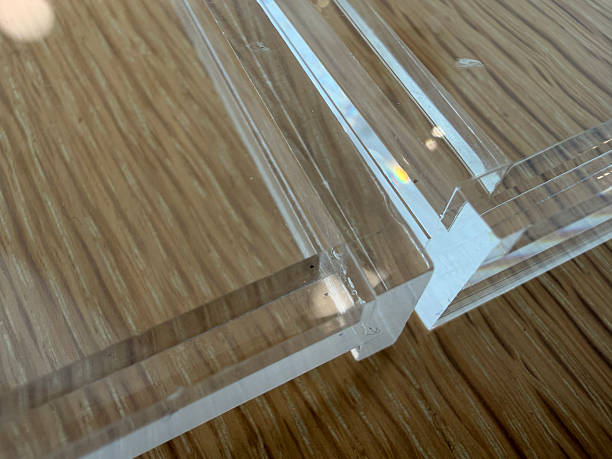 istock Clear acrylic plastic sheet detail on wooden texture table 2245444687