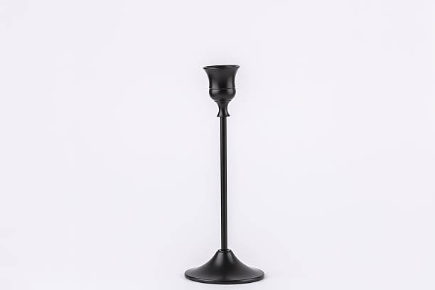 istock Single black metal candle holder on white background, simple and modern composition with copy space. Concept of minimalist home decoration 2245446011