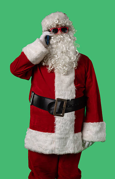 istock Santa Claus talking on his smartphone against a green chroma key background 2245453976