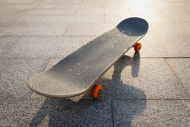 istock Skateboard outdoors in sunrise city 2245456582