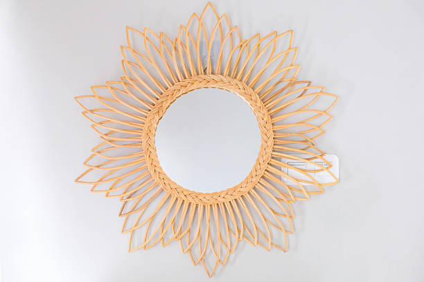 istock Decorative rattan mirror on the wall 2245458303