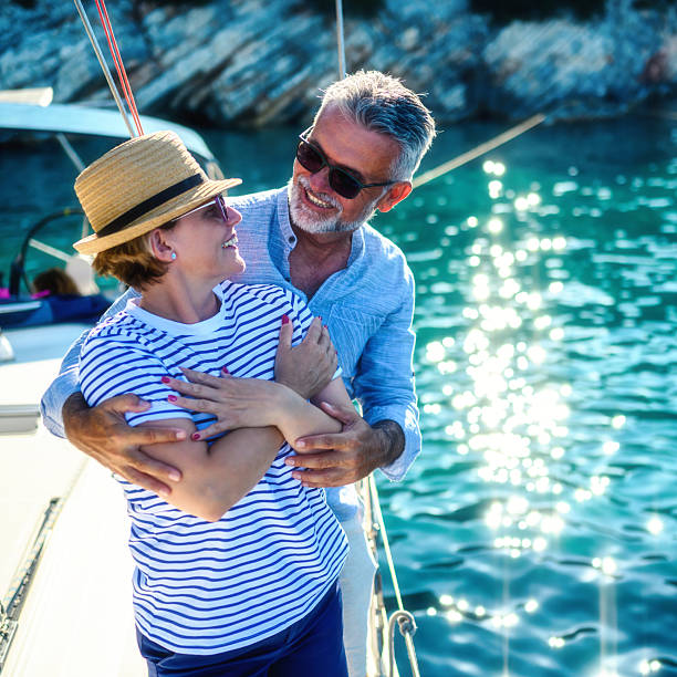 istock Senior couple in love sailing together 2245460379