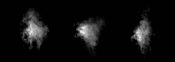 istock White smoke clouds floating on a black background, creating a mysterious and abstract texture ideal for graphic design, visual effects, or digital backgrounds in creative projects. 2245460818