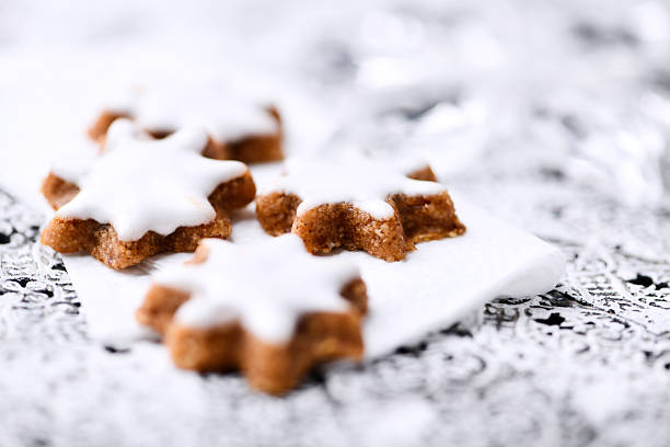 Christmas cookies (cinnamon stars) on bright background. Soft focus. Close up
