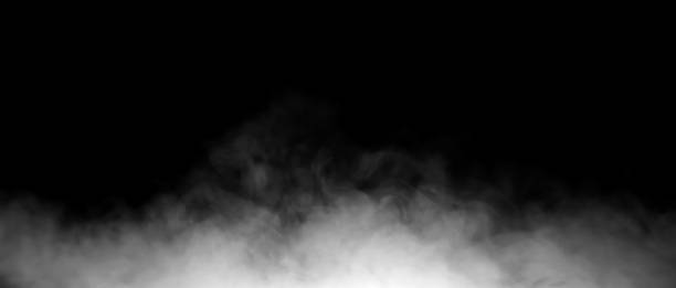 istock White smoke or fog rising from the bottom on a black background, creating a dark and mysterious texture perfect for visual effects, design backgrounds, or atmospheric scenes. 2245461124