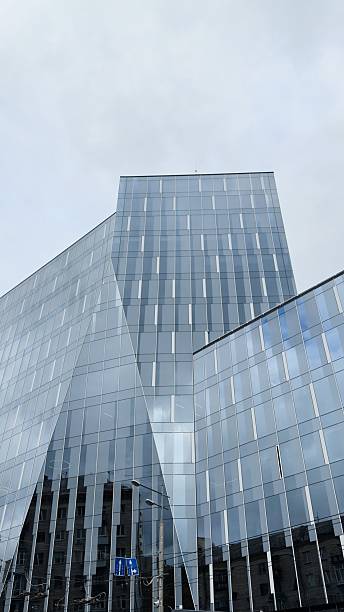 istock A modern glass building with a dynamic facade and urban context — an architectural highlight for presentations, developers' websites, advertising campaigns, urban projects, and business backgrounds. 2245462089
