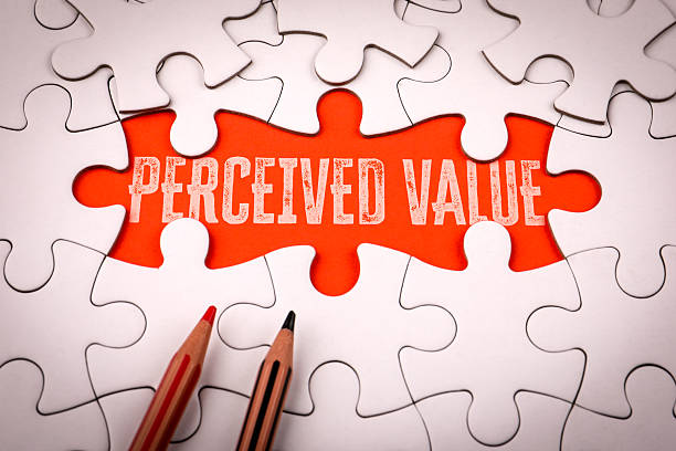 istock Phrase perceived value written on red background under white puzzle pieces symbolizing marketing psychology pricing and customer perception concept 2245462259