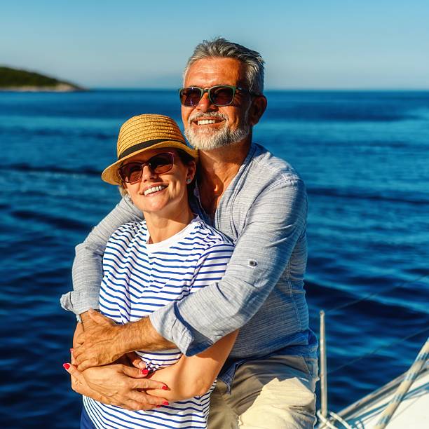 istock Senior couple in love sailing together 2245462838