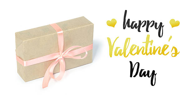 istock Happy Valentine's Day gift box with pink ribbon on white background 2245462840