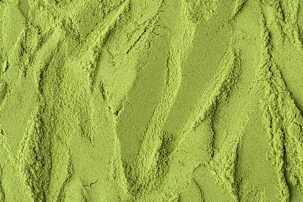 istock Flowing textured surface of green matcha powder creates a dynamic, natural background perfect for health, food, or branding visuals. 2245462945