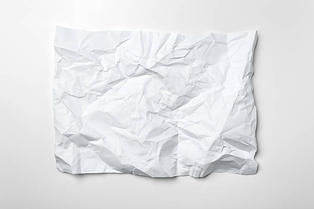 istock Wrinkled white paper resting on a flat surface in soft light 2245466917
