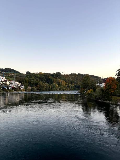 istock Serene river landscape with autumn trees. 2245467739