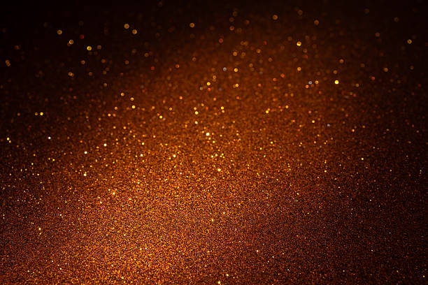 istock Concentrated bottom light highlights brown textured surface golden shimmer fading into dark top 2245467990
