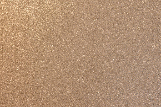 istock Warm beige glitter texture macro focus glowing softly golden highlights delicate even shimmering 2245468048