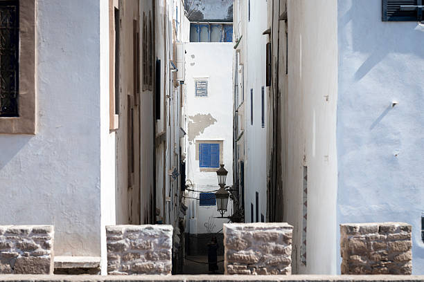 Traditional Moroccan architecture in Essaouira. Whitewashed buildings in old medina. White buildings with blue details in Essaouira medina near the port, Morocco.