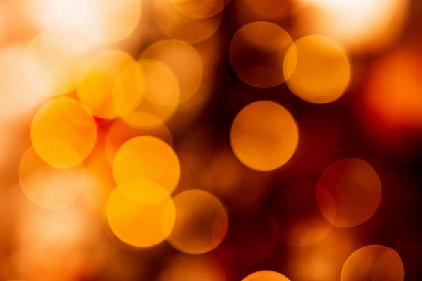 istock Blurred warm red and golden Christmas lights. 2245468509