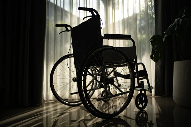 Wheelchair by the window with sunlight.