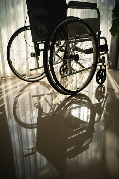 istock Wheelchair by the window. 2245468586