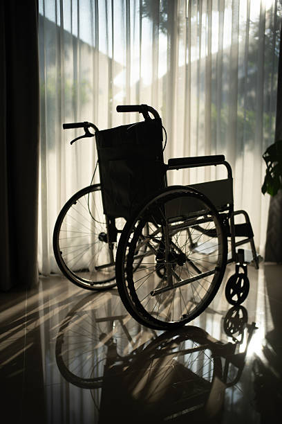 Old wheel chair left on sidewalk