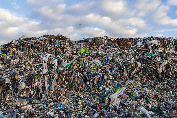 istock Garbage accumulates in a large landfill, showcasing pollution and ecological issues caused by plastic waste and debris in the environment 2245471172