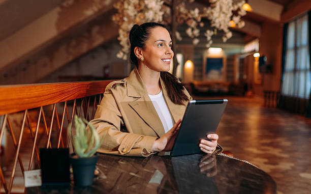 istock Happy businesswoman browsing on digital tablet 2245472277