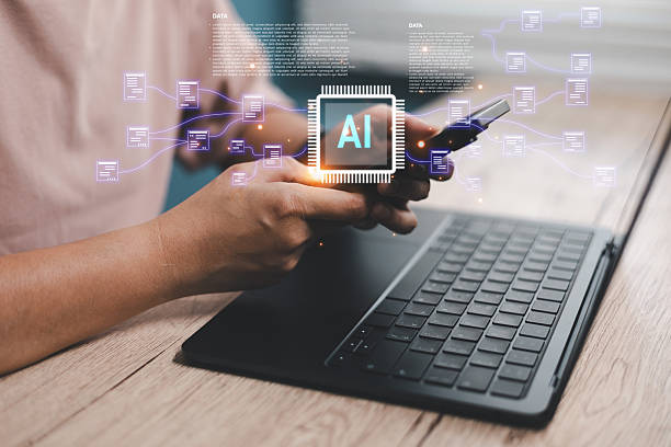 istock Person using smartphone and laptop with glowing AI chip icon, representing artificial intelligence, data network, digital transformation, smart technology modern business innovation concepts 2245472869