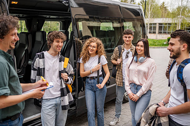 istock Students preparing for bus travel on school trip 2245474973