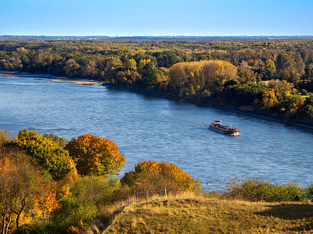 istock Autumn Danube river landscape with boat, Slovakia 2245477754