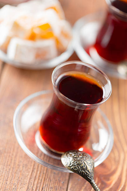 istock Turkish tea served in elegant glasses on a wooden table with traditional sweets 2245478201