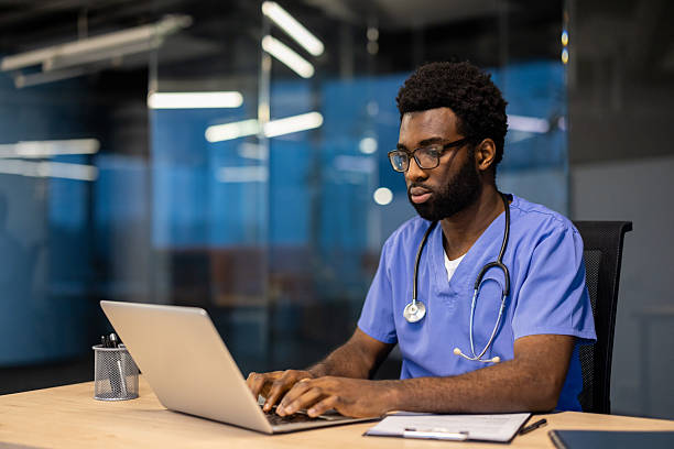 istock Medical professional working on a laptop in a modern office environment 2245480810