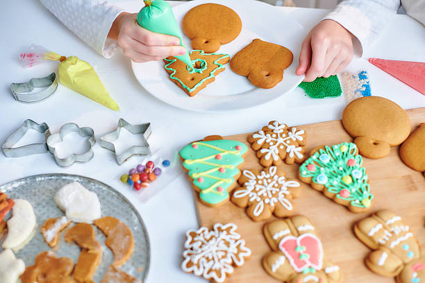 istock Children decorate christmas gingerbread. 2245482499