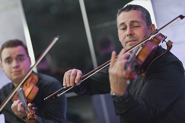 istock Violinist Playing In a Live Music Session With Focused Expression and Bow Motion 2245483434