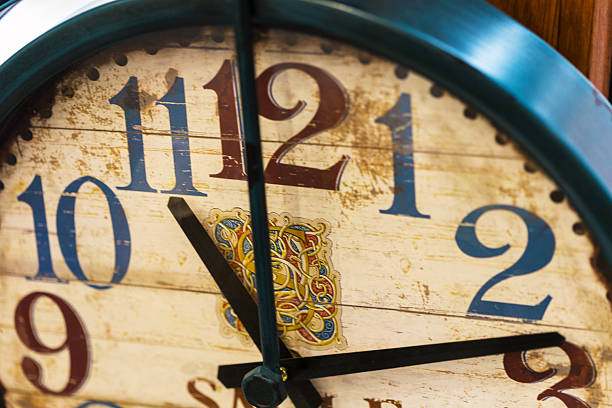 istock Decorative wall clock shows time with vintage design and colorful numerals 2245485692