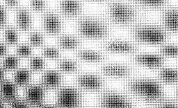 Grainy black half tone textured pattern.
