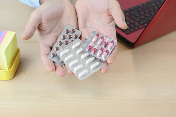 istock Hands Holding Blister Packs Of Medication 2245493336