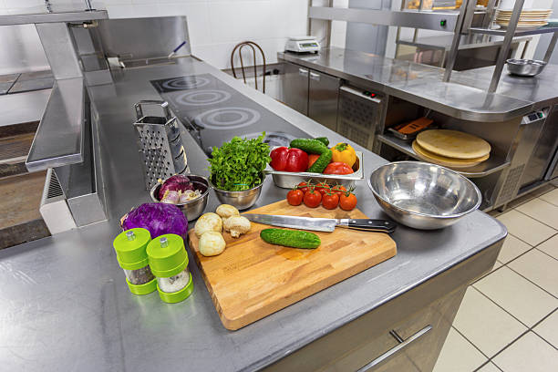 istock Fresh vegetables and kitchen tools arranged for meal preparation in a modern kitchen 2245495629