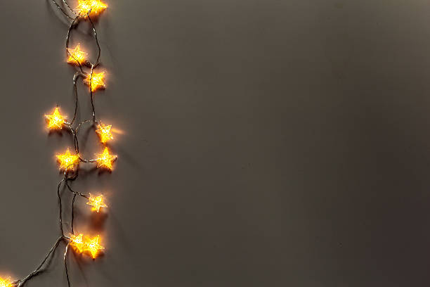 istock Twinkling star lights illuminating a dark wall during the evening hours 2245495642