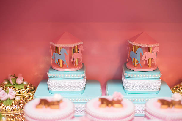 Fluffy birthday cake with a candle on pink and soft balloon surface.