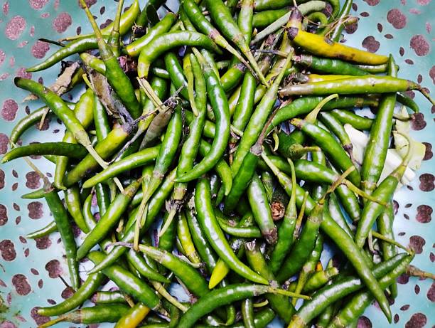 istock Fresh Green Chili Peppers Basket 2245497452