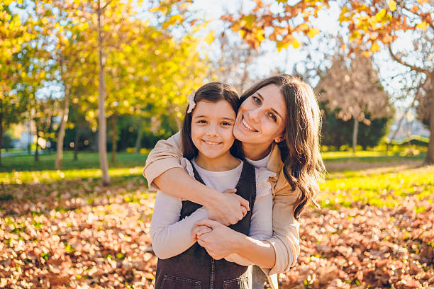 istock Mom with daughter enjoy in park 2245497935
