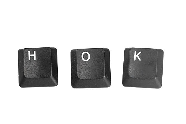 Three black keyboard keys showing the letters H, O, and K on a plain white surface.