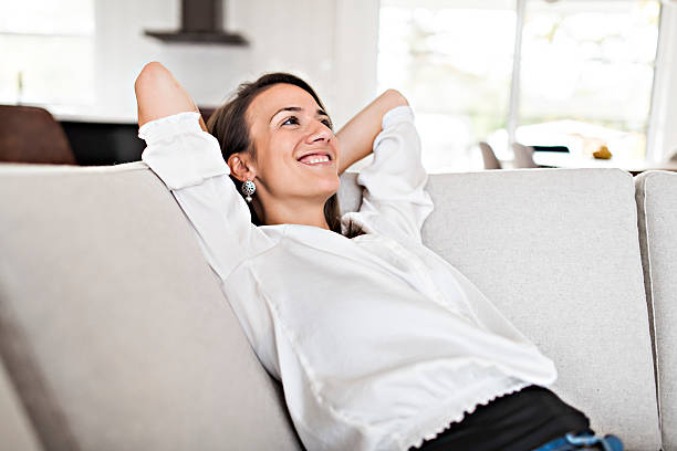 istock Relax Brunette having good time on the living room 2245502287