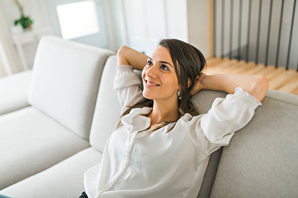 istock Relax Brunette having good time on the living room 2245502306