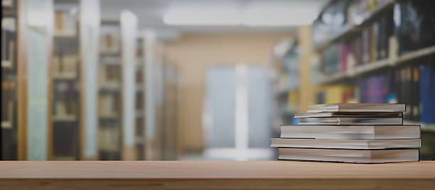 istock Stack of books on wooden table in library 3D rendering 2245503101
