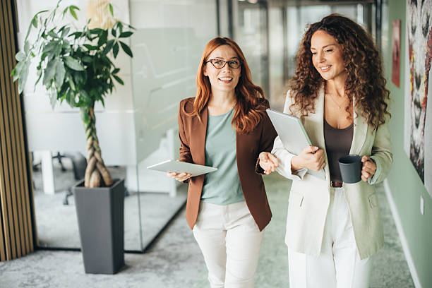 istock Confident female professionals talking on the go 2245504797
