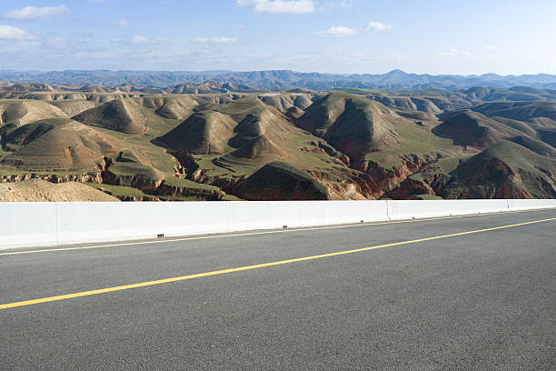 The loess plateau landscape behind the empty highway, car advertisement image