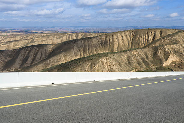 The loess plateau landscape behind the empty highway, car advertisement image
